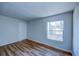 Spacious bedroom with wood-look flooring and neutral walls at 637 Twin Lake Ave, Deltona, FL 32738