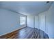 Bright bedroom with wood-look flooring, large window, and neutral walls at 637 Twin Lake Ave, Deltona, FL 32738