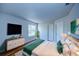 Comfortable bedroom features laminate floors and is illuminated with natural light, creating a cozy atmosphere at 637 Twin Lake Ave, Deltona, FL 32738