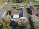 Aerial view of a single-story house with a large backyard and covered patio at 824 Mentmore Cir, Deltona, FL 32738