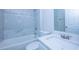 Updated bathroom with white vanity, quartz countertop and tiled shower at 824 Mentmore Cir, Deltona, FL 32738
