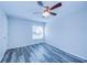 Bedroom with window, ceiling fan and wood-look floors at 824 Mentmore Cir, Deltona, FL 32738