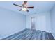 Bedroom with ceiling fan and gray vinyl flooring at 824 Mentmore Cir, Deltona, FL 32738