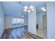 Dining area with hardwood floor and kitchen access at 824 Mentmore Cir, Deltona, FL 32738