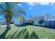 House exterior with palm tree and fenced yard at 824 Mentmore Cir, Deltona, FL 32738