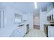 Modern kitchen with white cabinets and stainless steel appliances at 824 Mentmore Cir, Deltona, FL 32738