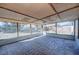 Spacious screened porch with concrete flooring and backyard view at 824 Mentmore Cir, Deltona, FL 32738