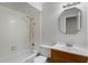 White tiled bathroom with single vanity and shower at 924 Poplar Dr, Altamonte Springs, FL 32714