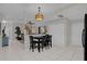 Kitchen with breakfast bar, view into living area at 956 Ponderosa Pine Ct, Orlando, FL 32825