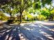 Exterior view of a community with lush landscaping and tree-lined streets at 1075 Kensington Park Dr # 203, Altamonte Springs, FL 32714