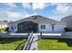 Home's back elevation and patio area at 1112 Hull Island Dr, Oakland, FL 34787