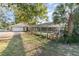 Backyard with pool, screened enclosure, and detached garage at 1265 Lake Francis Dr, Apopka, FL 32712