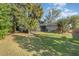 Landscaped backyard with partial view of home at 1265 Lake Francis Dr, Apopka, FL 32712