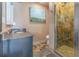 Bathroom with stone tile shower and granite countertop at 1265 Lake Francis Dr, Apopka, FL 32712