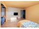 Bedroom with mustard colored walls and patterned bedding at 1265 Lake Francis Dr, Apopka, FL 32712