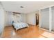 Main bedroom with hardwood floors and large closet at 1265 Lake Francis Dr, Apopka, FL 32712