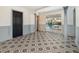 Bright dining room with patterned floor, gray accents, and pool view at 1265 Lake Francis Dr, Apopka, FL 32712