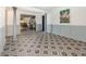 Elegant dining room with patterned tile floor and gray wainscoting at 1265 Lake Francis Dr, Apopka, FL 32712