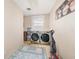 Laundry room with washer, dryer, and storage at 1265 Lake Francis Dr, Apopka, FL 32712