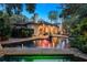Home with covered patio, pool, and lush landscaping at 1426 Nottingham St, Orlando, FL 32803