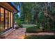 Landscaped backyard with flagstone patio and lush tropical plantings at 1426 Nottingham St, Orlando, FL 32803