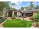 Landscaped backyard with patio, lawn, and house exterior at 1426 Nottingham St, Orlando, FL 32803