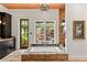 Well-lit bathroom featuring a garden view from the tub, dark wood cabinetry, and an elegant design at 1426 Nottingham St, Orlando, FL 32803