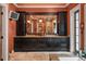 Elegant bathroom with dark wood cabinets and granite countertops at 1426 Nottingham St, Orlando, FL 32803