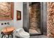 Unique bathroom featuring a stone shower and sink, accompanied by elegant fixtures and artistic decor at 1426 Nottingham St, Orlando, FL 32803