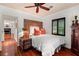 Comfortable bedroom featuring hardwood floors and a carved wooden headboard at 1426 Nottingham St, Orlando, FL 32803