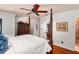 Bright bedroom featuring hardwood floors and a classic four-poster bed at 1426 Nottingham St, Orlando, FL 32803