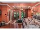 Spacious main bedroom with a large bed, French doors and a sitting area at 1426 Nottingham St, Orlando, FL 32803