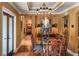 Elegant dining room featuring a large table, chandelier, and hardwood floors at 1426 Nottingham St, Orlando, FL 32803