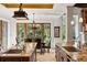 Gourmet kitchen view with granite countertops, dark wood cabinetry, and seamless access to the dining room at 1426 Nottingham St, Orlando, FL 32803