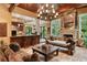 Open living space featuring a cozy fireplace and large windows at 1426 Nottingham St, Orlando, FL 32803