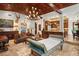 Open-concept living area with wood-beamed ceilings, a kitchen view, and ample space for relaxation and entertainment at 1426 Nottingham St, Orlando, FL 32803