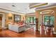 Bright living room with hardwood floors, ample seating, and views of backyard at 1426 Nottingham St, Orlando, FL 32803