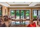 Spacious living room with hardwood floors, large windows, and access to a patio at 1426 Nottingham St, Orlando, FL 32803