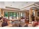 Open living and dining area with hardwood floors, a fireplace, and large windows at 1426 Nottingham St, Orlando, FL 32803