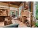 Spacious living room features a large stone fireplace,high ceilings, and an open floor plan at 1426 Nottingham St, Orlando, FL 32803