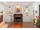 Cozy living room features a fireplace, built-in shelves, and hardwood floors at 1426 Nottingham St, Orlando, FL 32803
