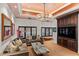 Bright living room with coffered ceiling, recessed lights, and dark wood built-ins at 1426 Nottingham St, Orlando, FL 32803