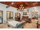 Cozy living room featuring a striking wood-beamed ceiling and a grand chandelier at 1426 Nottingham St, Orlando, FL 32803