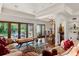 Living room featuring hardwood floors, patio doors, chandelier, and decorative furnishings at 1426 Nottingham St, Orlando, FL 32803