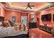 Main bedroom with hardwood floors, a large TV and sitting area at 1426 Nottingham St, Orlando, FL 32803