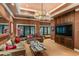 Media room featuring a large TV, comfortable seating, and built-in shelving at 1426 Nottingham St, Orlando, FL 32803