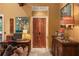 Home office with ornate wooden doors and built-in shelving at 1426 Nottingham St, Orlando, FL 32803