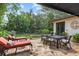 Stone patio with outdoor seating and dining areas at 1426 Nottingham St, Orlando, FL 32803