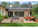 Outdoor patio with seating, dining area, and lush landscaping at 1426 Nottingham St, Orlando, FL 32803