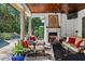 Relaxing patio features outdoor fireplace and lush landscaping at 1426 Nottingham St, Orlando, FL 32803